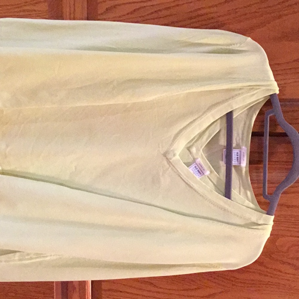 Lime green v-neck sleeveless shell and sweater.